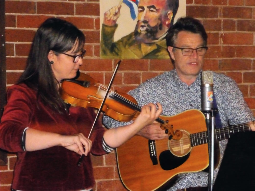 Sally and Andrew Sally playing violin and Andrew playing guitar