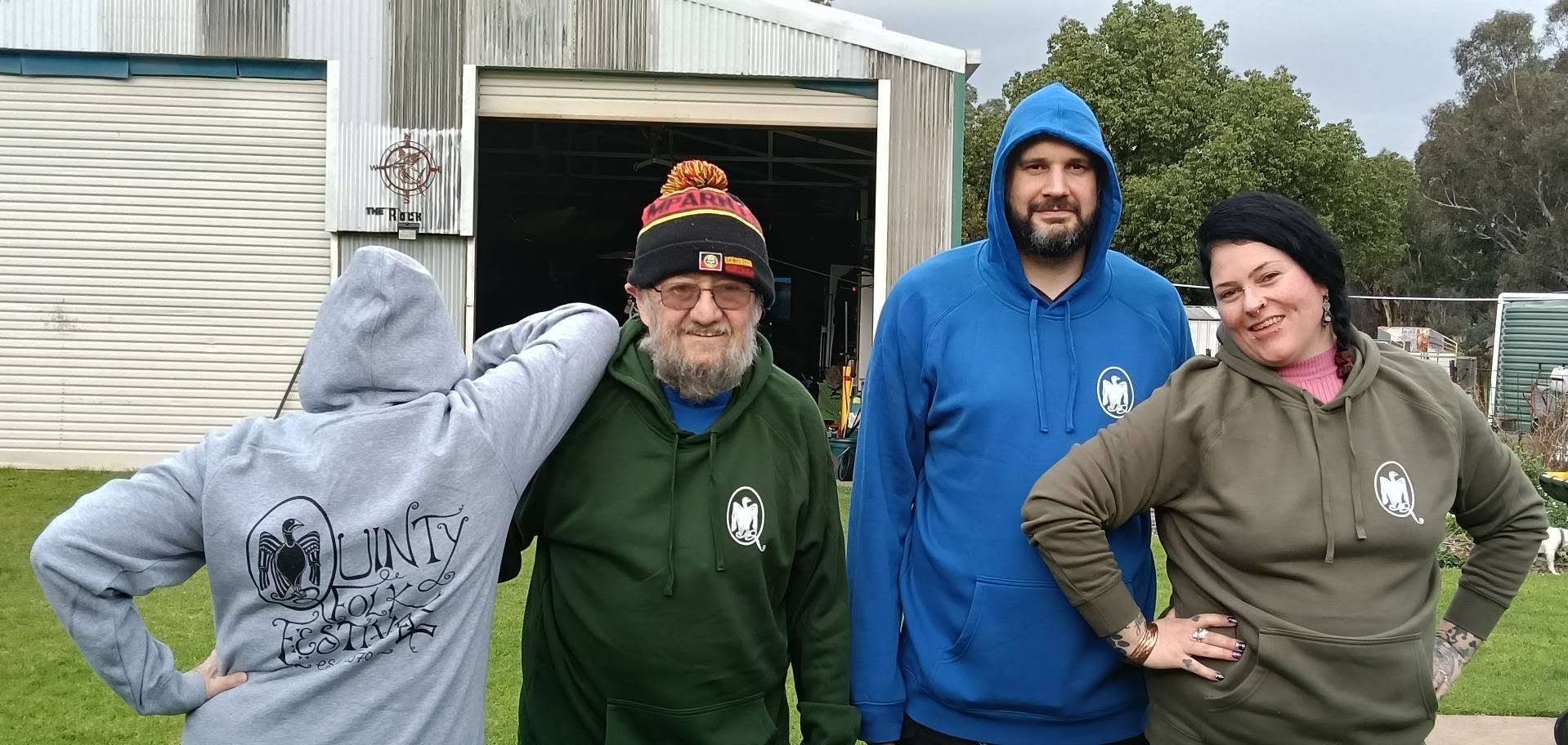 photo of various committee members wearing Quinty hoodies
